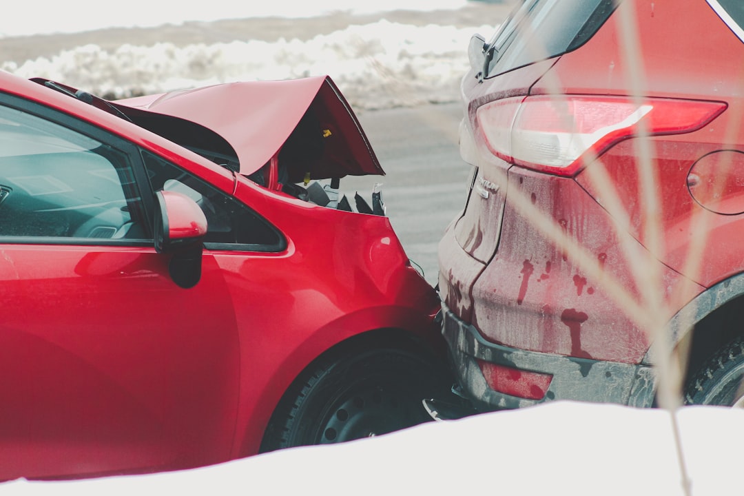 a red car parked next to another red car