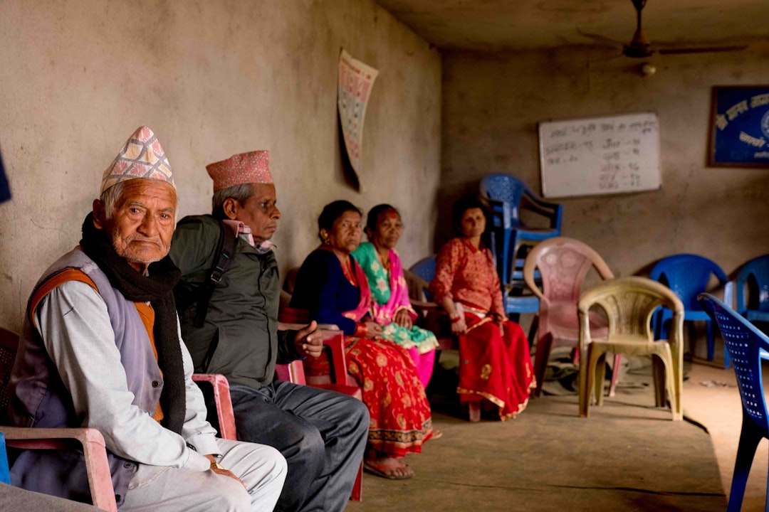 a group of people sitting next to each other