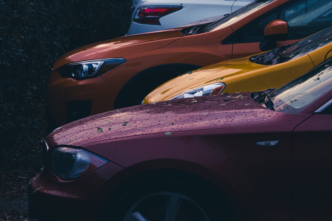 red and yellow car on road